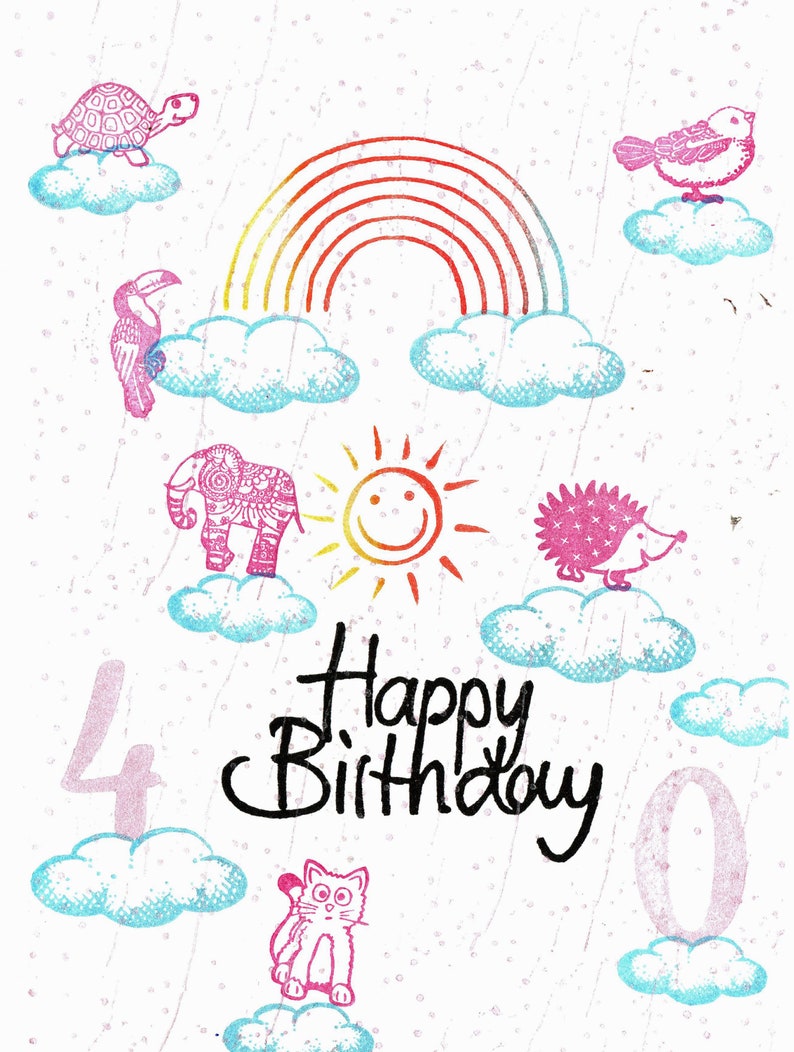 May include: A colorful birthday card with a rainbow, clouds, and animals. The card says "Happy Birthday" and has the numbers 40 on it.