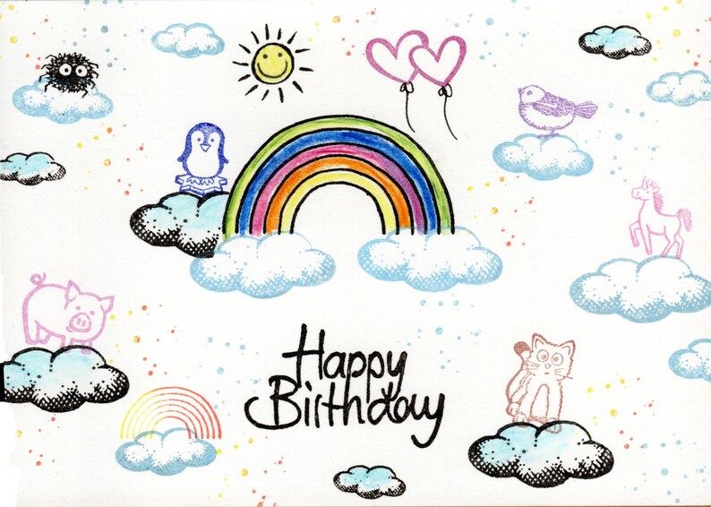 May include: A colorful birthday card with a rainbow, clouds, a sun, a penguin, a pig, a cat, a unicorn, and a bird. The card says "Happy Birthday" in black cursive writing.