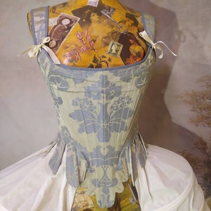 Historical corset of the eighteenth century, in precious damask fabric. Cotton lining. Back lacing
