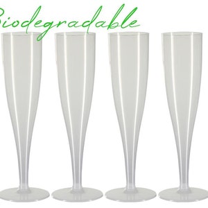 May include: Four clear plastic champagne flutes with a wide base and tall, slender bowl. The word "Biodegradable" is written in green cursive above the flutes. The flutes are arranged in a row against a white background.