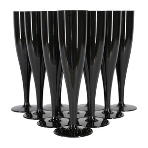 May include: A set of eight glossy black champagne flutes arranged in a triangular formation. Each flute features a tall, slender bowl that tapers down to a narrow stem and a wide, circular base, all crafted from a solid, opaque black material.