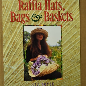 May include: A book titled "How to Make Raffia Hats, Bags & Baskets" with a photo of a woman wearing a raffia hat and holding a basket of flowers.