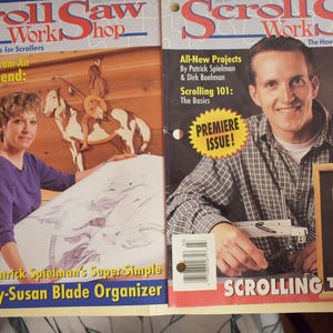May include: Two issues of "Scroll Saw Workshop" magazine. The left cover features a woman with a wooden horse and rider, with text about intarsia techniques. The right cover has a man holding a framed wood portrait, with text "Scrolling the Duke."