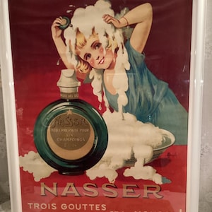 Póster enmarcado de publicidad vintage de Nasser-Trois Gouttes/Marceline Auzolle