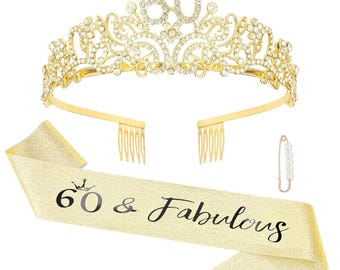 May include: A gold-colored tiara with the number 60 in rhinestones, a matching sash that reads "60 & Fabulous", and a pearl-adorned safety pin. The tiara has a comb on each side for secure placement.