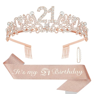 May include: Rose gold tiara with the number 21, adorned with clear rhinestones. Includes a matching sash that reads "It's my 21 Birthday". A pearl-like pin is also included. Perfect for a 21st birthday celebration.