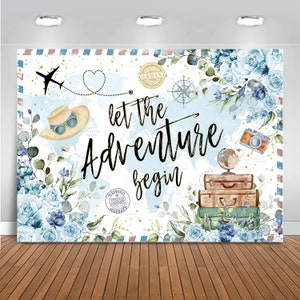 May include: A travel-themed backdrop featuring a world map, blue floral accents, and the phrase "let the adventure begin." The design includes a straw hat with sunglasses, a vintage camera, and stacked suitcases.