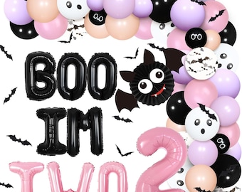 May include: A Halloween-themed party decoration set with black, pink, and purple balloons, a black bat, and black and pink foil letters spelling "BOO I'M TWO".