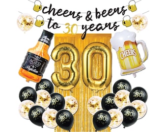 May include: Gold 30th birthday party decorations with black and gold balloons, a gold foil '30' balloon, a bottle of whiskey, and a beer mug balloon. The banner reads 'Cheers & Beers to 30 Years'.
