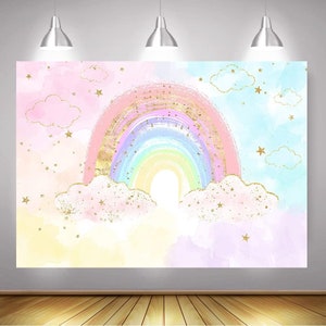 May include: A pastel rainbow with gold glitter accents, set against a backdrop of clouds and stars. The rainbow is painted in shades of pink, purple, blue, green, and yellow. The clouds are white with gold glitter accents. The stars are gold.