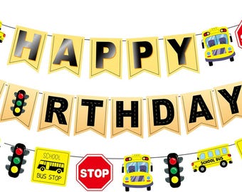 May include: A festive banner with the words "HAPPY BIRTHDAY" in black letters on yellow pennants. The banner is decorated with yellow school buses, traffic lights, and stop signs, perfect for a birthday celebration.