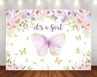 May include: A white backdrop with a purple butterfly with gold glitter, pink and purple flowers, and gold glitter. The text "it's a girl" is written in purple.