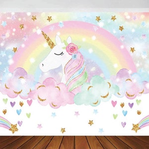 May include: A white unicorn with a rainbow mane and a flower crown is lying on a cloud with a rainbow in the background. The background is filled with gold glitter stars and hearts.