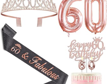 May include: Rose gold 60th birthday party decorations including a tiara, balloons, a sash, a cake topper, and candles. The sash is black with rose gold lettering that says "60 & Fabulous".