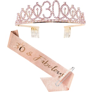 May include: A gold tiara with pink rhinestones and the number 30 on top. A pink and gold sash with the text "30 & Fabulous" and a safety pin are included.