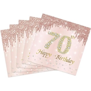 May include: A stack of pink and gold napkins with a glittery design. The napkins feature the number 70 with rhinestones and the text "Happy Birthday" in gold lettering.