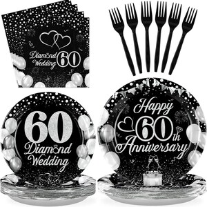 May include: Black and silver 60th Diamond Wedding and Anniversary party supplies. Includes plates, napkins, and black forks. The plates and napkins feature the number 60, hearts, and balloon designs.