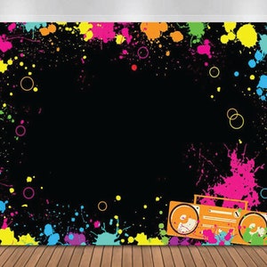 May include: A black background with colorful paint splatters and a retro boombox in the bottom right corner. The boombox is orange and yellow with black accents.
