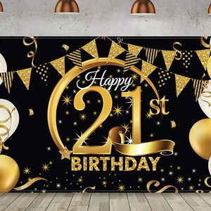 May include: Black and gold happy 21st birthday banner with gold confetti and white balloons. The banner has a large gold number 21 with stars and a gold ribbon.
