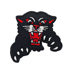 May include: Black embroidered patch of a snarling panther with red teeth and white claws.