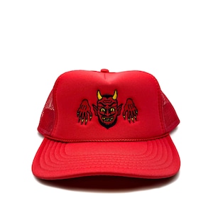 May include: Red trucker hat with a black and yellow embroidered devil graphic.