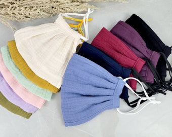 Mascarilla facial de gasa doble de algodón orgánico, transpirable y reversible.