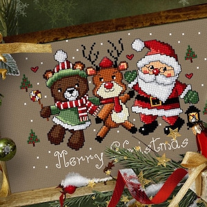 Cute Christmas cross-stitch pattern with Santa Claus, reindeer, and teddy bear. Christmas embroidery for festive decorations, PDF file