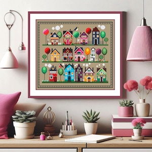 Könnte beinhalten: Ein farbenfrohes Kreuzstichmuster einer kleinen Stadt mit Häusern, Bäumen und Wolken. Die Häuser sind alle in verschiedenen Farben und Stilen gehalten, und die Bäume sind grün mit braunen Stämmen. Die Wolken sind weiß und flauschig.
