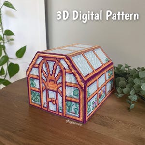 May include: A handcrafted, colorful needlepoint greenhouse with a detailed design. The structure features orange, purple, and blue hues, with the text "3D Digital Pattern" at the top. The design includes images of plants and flowers.