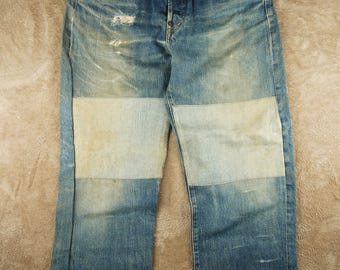 Levis 702XX Big E vintage con hebilla trasera, fabricado en Japón, orillo, estilo grunge desgastado.