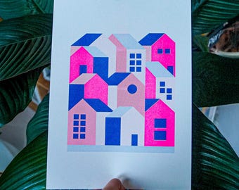 A3 risograph print of a pink blue little houses landscape