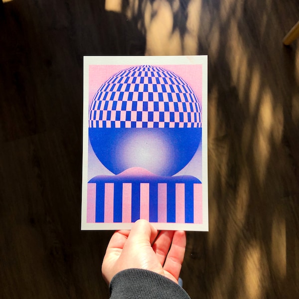small risograph card of a pink blue geometric landscape