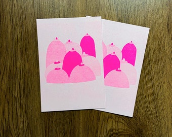 set of two risograph postcards of a boob landscape