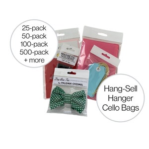 May include: A set of cellophane bags, pink tissue paper, and blue gift tags. The bags are labeled "Hang-Sell Hanger Cello Bags". There are also magnetic holders and dog bow ties in the image.