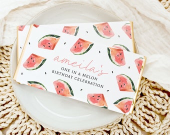 May include: A white chocolate bar wrapper with a watermelon pattern and the text "ameila's... One in a Melon Birthday Celebration".