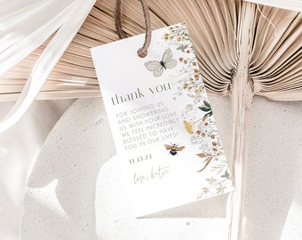 May include: A white thank you card with a floral design featuring a butterfly, bee, and leaves. The text reads "thank you for joining us and showering us with your love. We feel incredibly blessed to have you in our lives! 11.15.23 love, Katie"