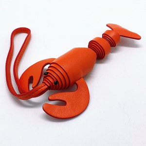 Handgemachter Taschenanhänger aus Kalbsleder in Orange