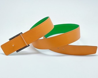 A 42mm genuine calf leather reversible belt, worthy replacement of class, bearing testament to the wearer's discerning taste and style.