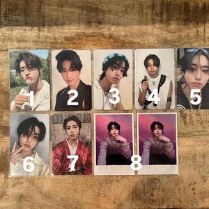 May include: A collection of eight photo cards featuring a young person in various poses and outfits. The cards are numbered 1 through 8. The images include close-up portraits and full-body shots, with different backgrounds and clothing styles.