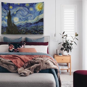 May include: A bedroom with a bed, a nightstand, a plant, and a tapestry featuring Vincent van Gogh's "The Starry Night" hanging on the wall.