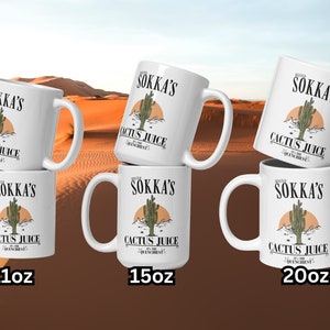 May include: White ceramic mugs with the text "Master Sokka's Cactus Juice" and a cactus illustration. The mugs are available in 11oz, 15oz, and 20oz sizes. The design includes a desert landscape with a setting sun.