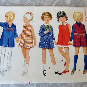 May include: A vintage sewing pattern for girls' dresses and a skirt. The pattern is for sizes 3-6 and 24. The pattern is from the Butterick company and the pattern number is 4727.