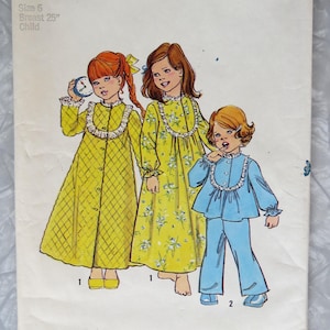 May include: A Simplicity sewing pattern envelope 6687 for a child's size 6, breast 25 inches. The illustration shows three children wearing sleepwear: two in long yellow nightgowns with lace collars and one in a blue pajama set with a lace collar.