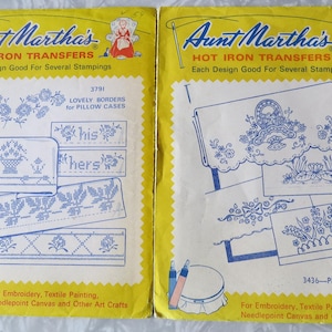 May include: Two vintage Aunt Martha's Hot Iron Transfer packets. One packet features designs for pillow cases, including floral borders and the words "his" and "hers." The other packet features pillow slip designs. Both packets are yellow.