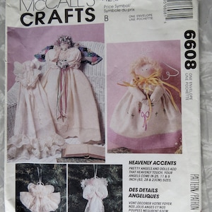 May include: A McCall's Crafts sewing pattern envelope 6608 for fabric angels and dolls. The cover features illustrations of finished angel figures in various sizes, including 25, 11, and 9 inches, with lace, ribbon, and fabric details.