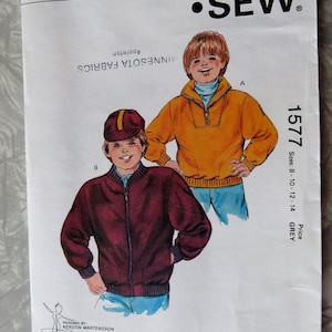 May include: Sewing pattern for two boys' jackets. The pattern is for sizes 8-10-12-14. One jacket is a yellow pullover with a zipper and the other is a maroon bomber jacket with a zipper. The pattern is from Kwik Sew Pattern Co., Inc. and is called "1577".