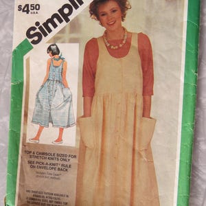 May include: Vintage Simplicity sewing pattern featuring a woman in a yellow dress with pockets. The pattern includes a top and camisole, sized for stretch knits. The price is $4.50.
