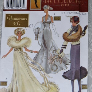 May include: A sewing pattern for a doll dress with three different styles. The pattern is for 11 1/2 inch (29 cm) fashion dolls. The pattern is called "Glamorous 30's" and is Simplicity pattern number 9704.