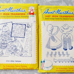 May include: Two vintage Aunt Martha's Hot Iron Transfers packets. The yellow packets feature designs for embroidery, textile painting, and needlepoint. One packet is labeled "3716--Baby Designs" and the other "3795 Sunbonnet Sue Overall Bill."