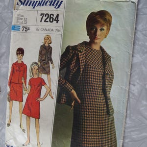 May include: Vintage Simplicity sewing pattern envelope. The envelope features illustrations of women's dresses and suits. The main image shows a woman wearing a houndstooth dress and jacket. The envelope has the text "Simplicity" and "Designer Fashion".